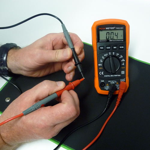 Orange Peak Meter Multimeter and probes testing conductivity of the meter and leads