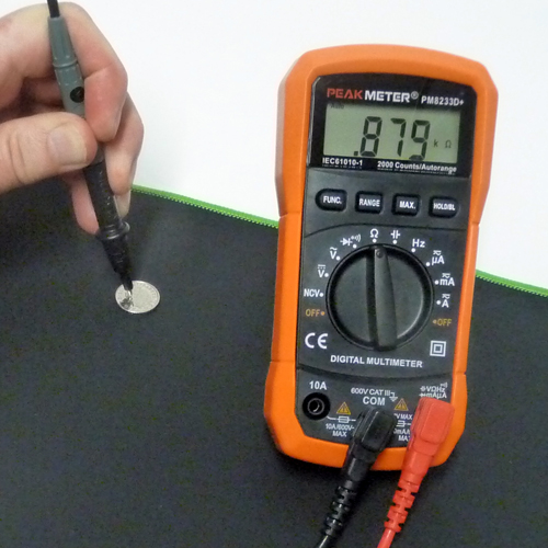 Orange Peak Meter Multimeter and probes on an earthing mat