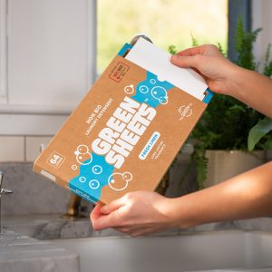 UK made Fresh Linen, Eco plastic free Green Sheets, kind to the environment washing strips 64 pack hands in kitchen
